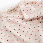 Langärmet bodystocking for newborns with snap closure and heart print