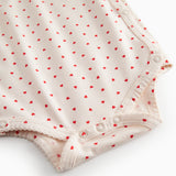 Langärmet bodystocking for newborns with snap closure and heart print