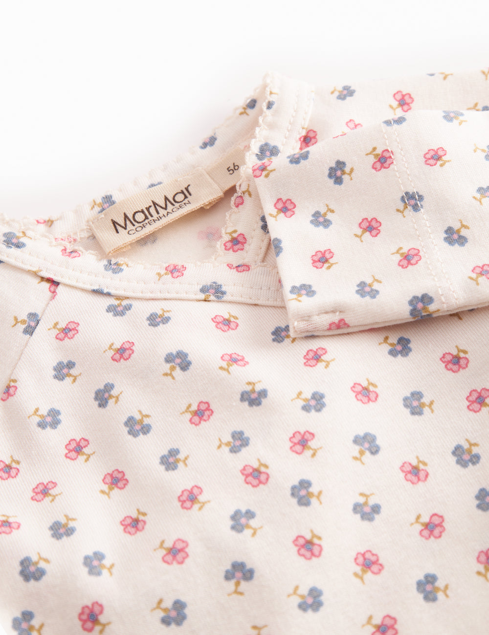 Fitted blouse for newborn baby with snap closure and floral print