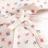 Fitted blouse for newborn baby with snap closure and floral print