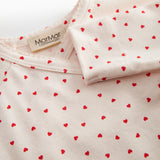 Fitted blouse for newborns with a snap closure and heart print