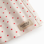 Fitted blouse for newborns with a snap closure and heart print