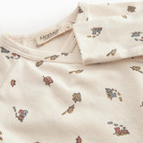 Fitted blouse for newborn baby with snap closure and train print