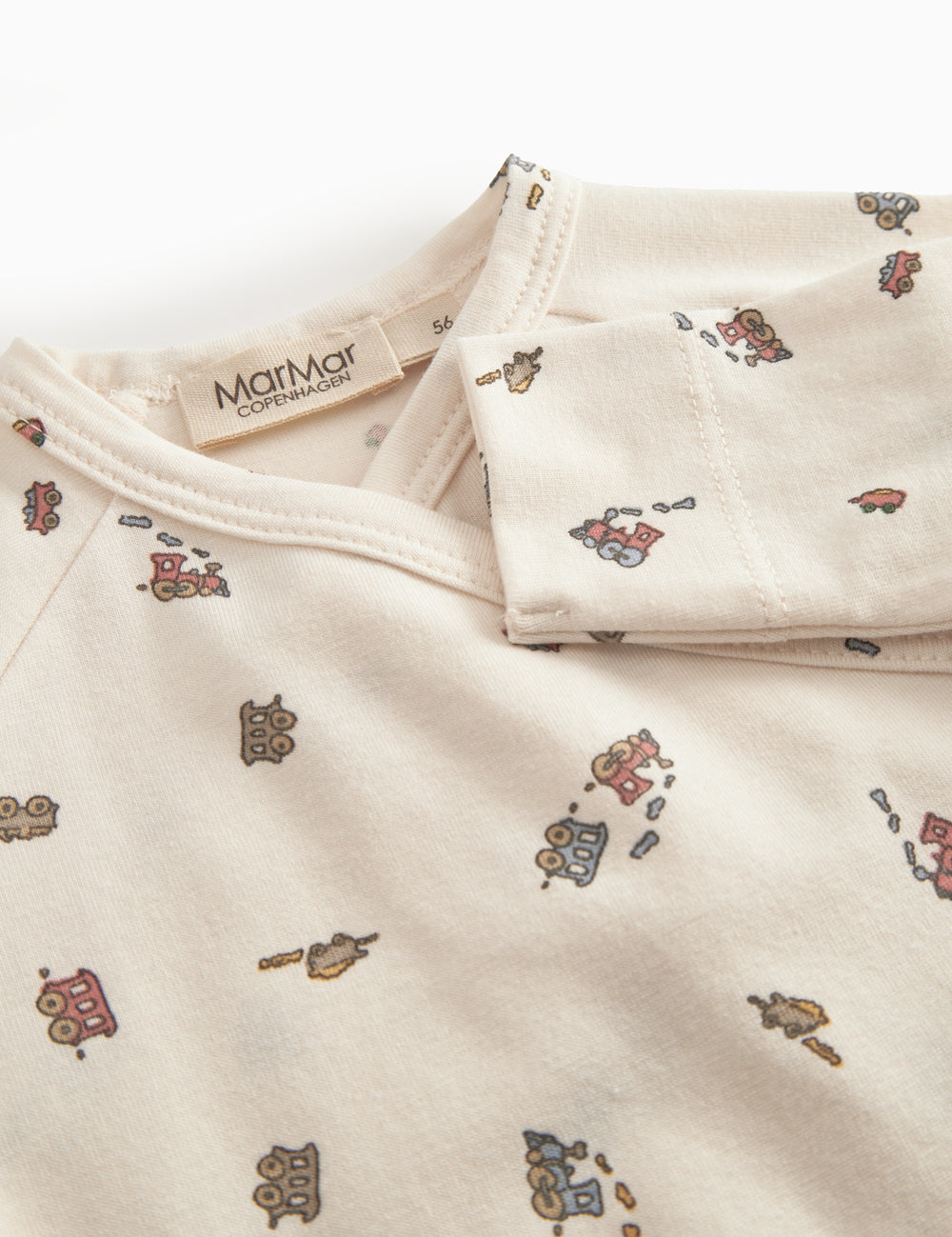 Long-sleeved onesie with feet and pattern for a newborn baby