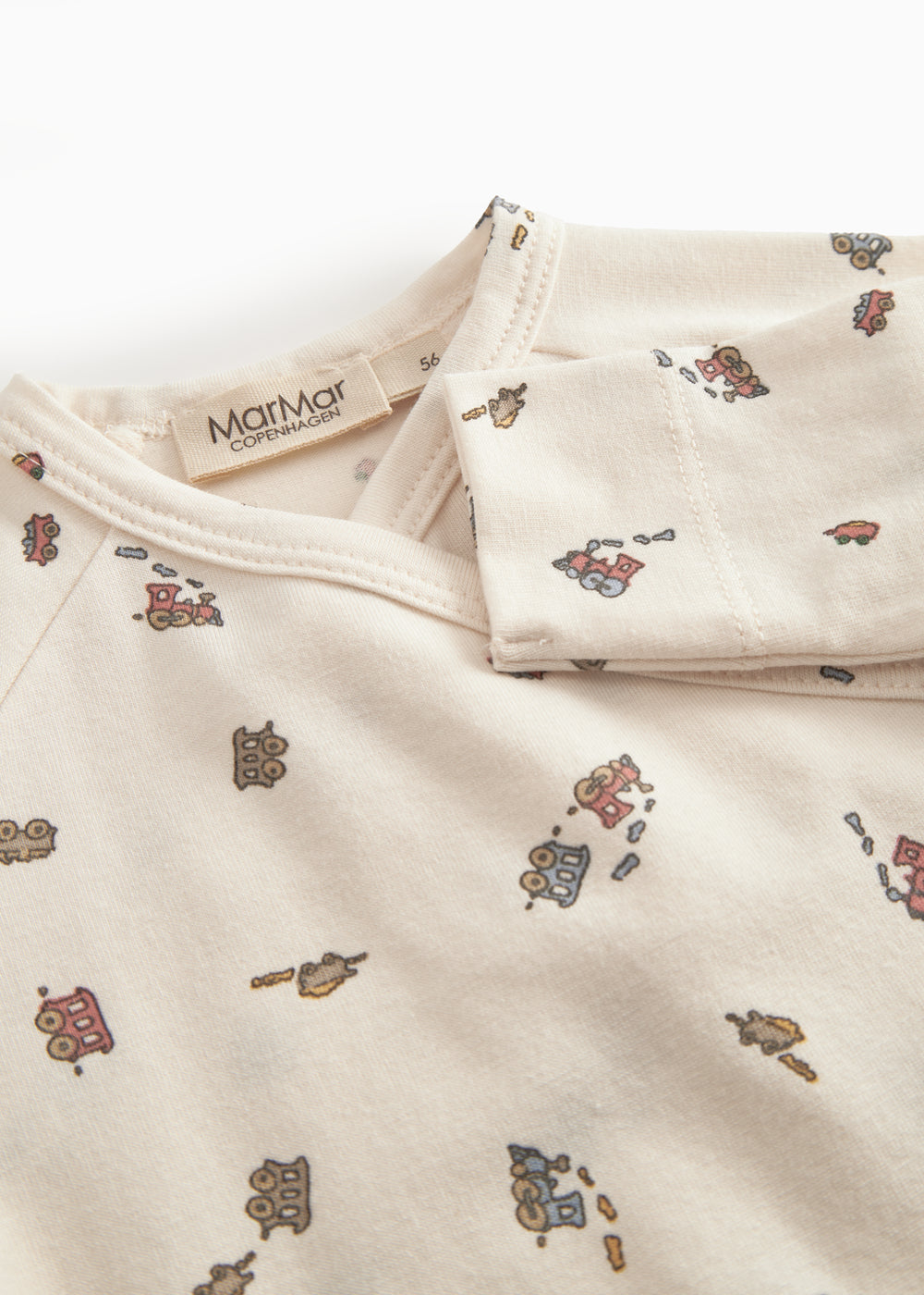 Long-sleeved onesie with feet and pattern for a newborn baby