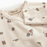 Long-sleeved onesie with feet and pattern for a newborn baby