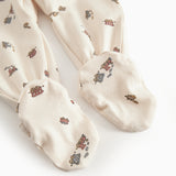 Long-sleeved onesie with feet and pattern for a newborn baby