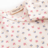 Long-sleeved onesie with feet and flower pattern for a newborn baby