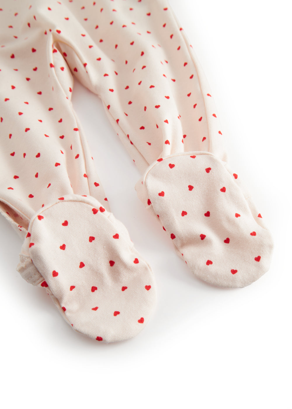 Langärmet baby heldragt with fødder, fint hjerte print and picotkanter

Baby long-sleeve onesie with feet, fine heart print and picot edges