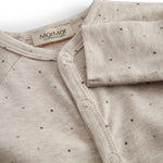Beige long-sleeved baby outfit with buttons