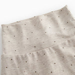 Beige baby pants with feet for newborns with a sweet print