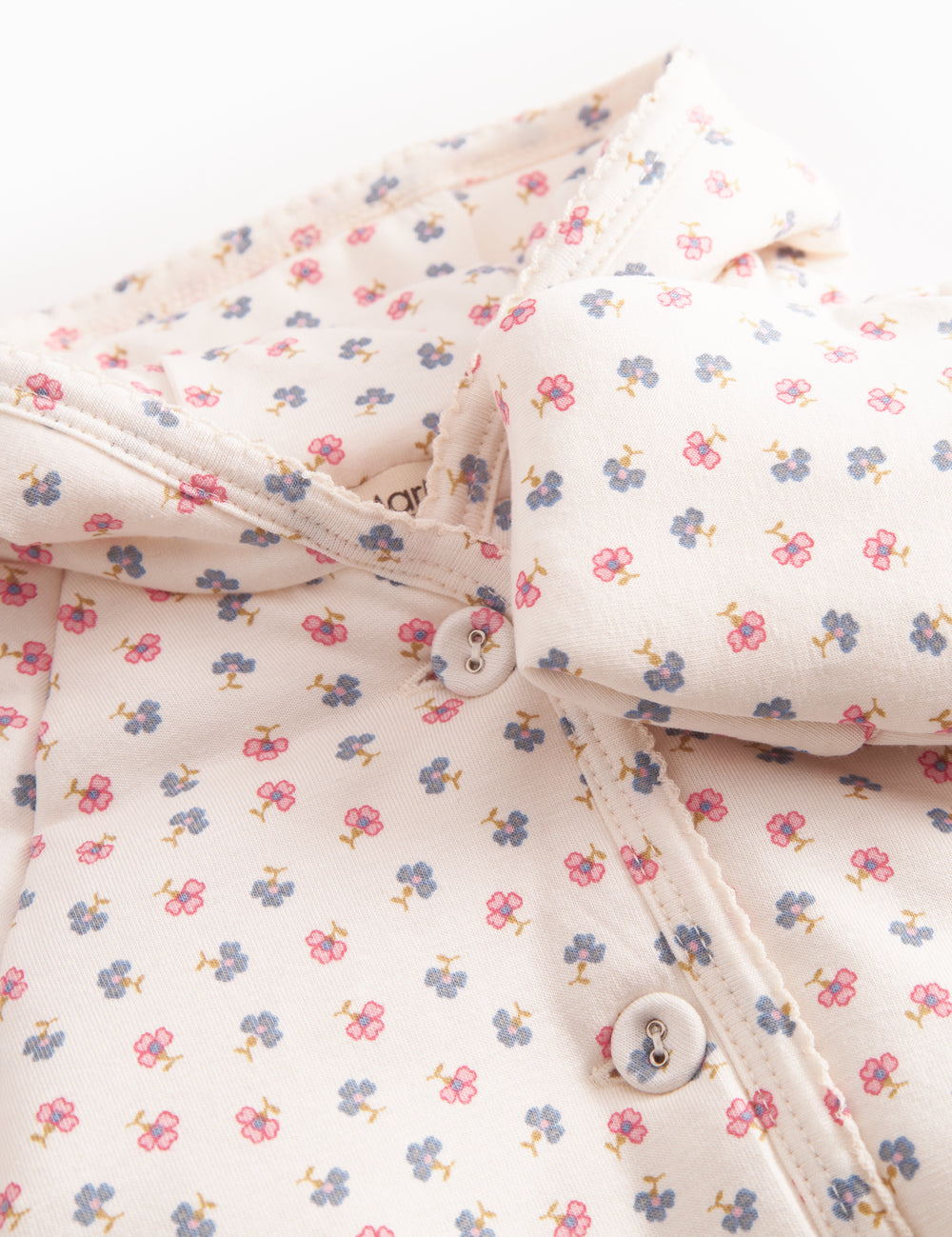The jacket for newborn and baby with hat, snap closure, and flower pattern.