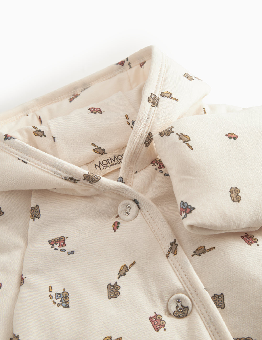 The jacket for newborn and baby with hat, snap closure, and train pattern.