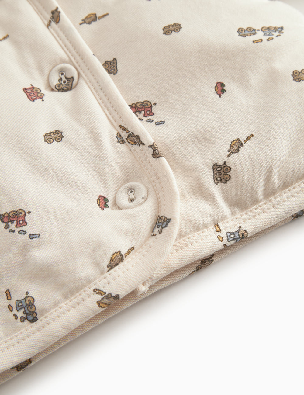 The jacket for newborn and baby with hat, snap closure, and train pattern.