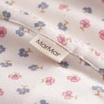 Baby blanket with rounded corners, picot edges, and floral print.