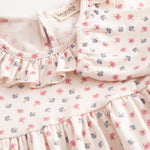 Langærmet baby bodystocking med flæser krave or blomster print