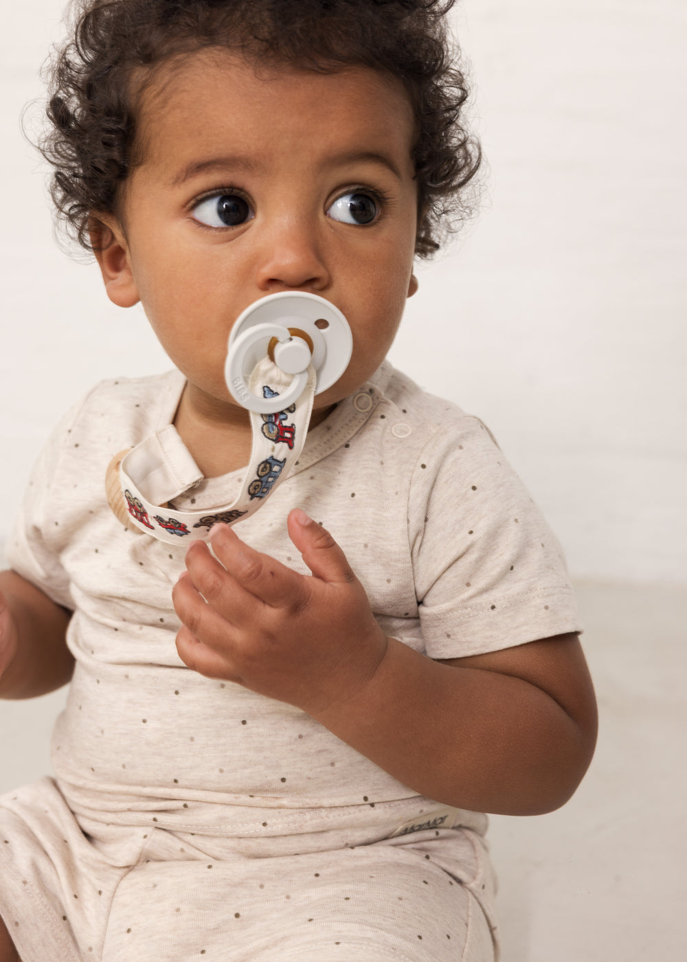 Baby with toys and teething rings
