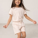 Wearing shorts and a t-shirt with a nice heart print.