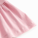 Red striped children's dress with long sleeves and a skirt.
