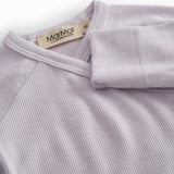 Lightly lined light purple bodystocking for newborns with snap closure.