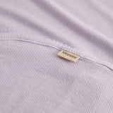 Light pink baby blanket with rounded corners and picot edges.