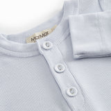 Light blue baby bodystocking with a peplum closure at the front