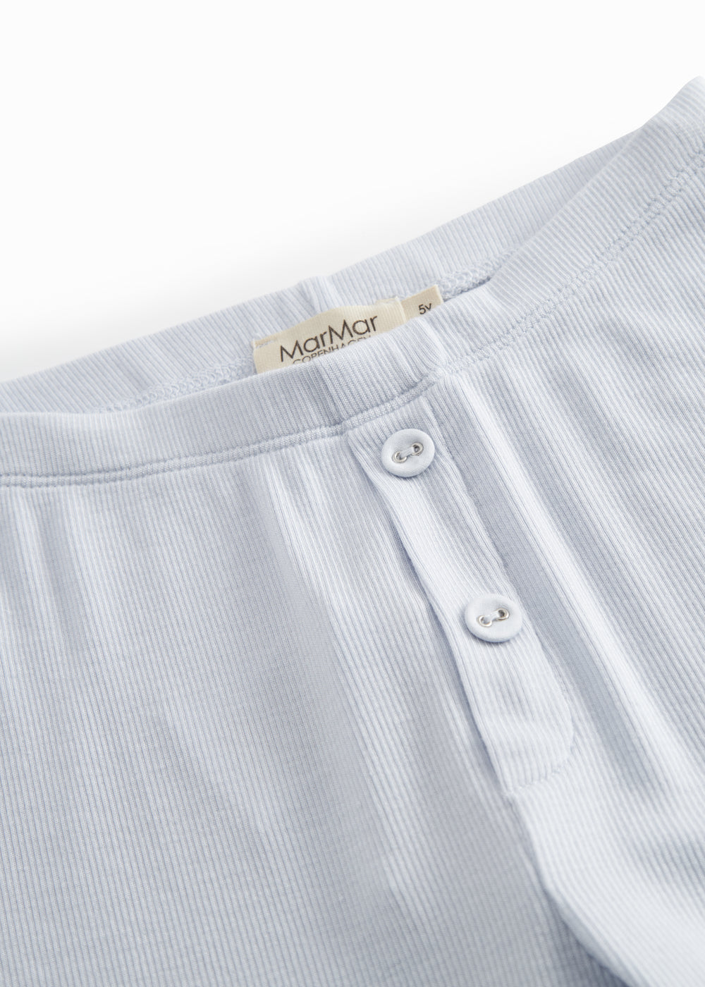 Blue leggings for children with decorative buttons and buttons.