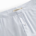 Blue leggings for children with decorative buttons and buttons.