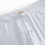 Blue leggings for children with decorative buttons and buttons.