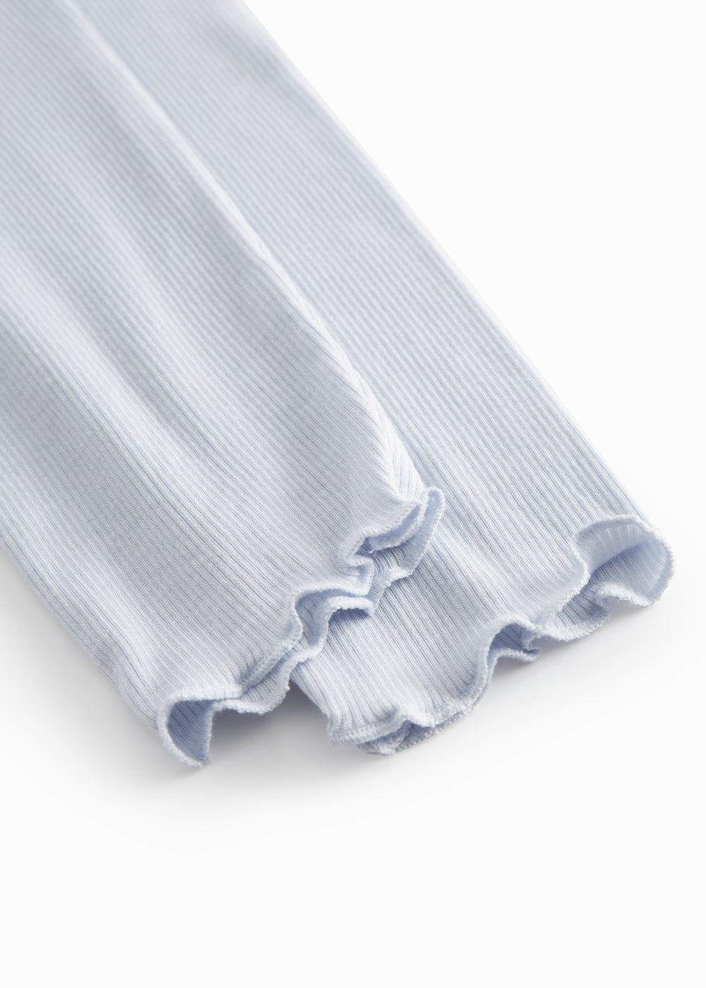 Lyseblå leggings til børn med fine flæsedetaljer forneden