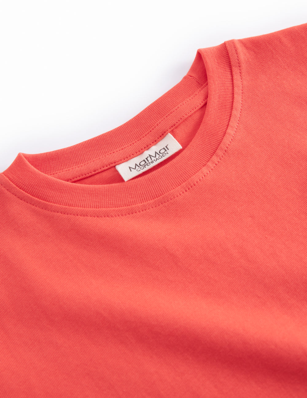 Orange børne-T-shirt med lille broderet frugtmotiv