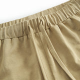 Beige børneshorts med bred elastik og bindebånd 