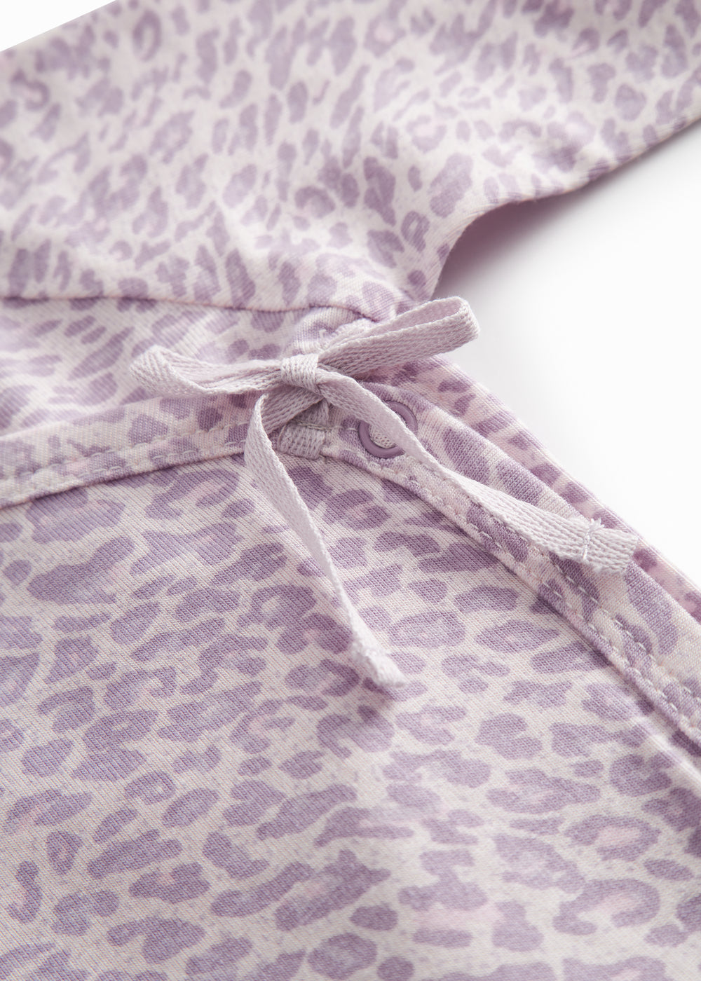 Little long-sleeved leopard bodystocking for newborns