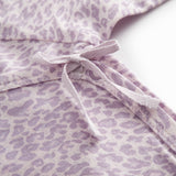 Little long-sleeved leopard bodystocking for newborns
