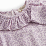 Pink long-sleeved leopard baby bodystocking with ruffled collar.