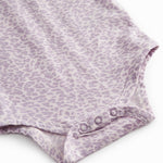 Pink long-sleeved leopard baby bodystocking with ruffled collar.