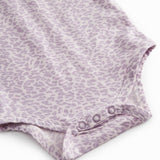 Pink long-sleeved leopard baby bodystocking with ruffled collar.