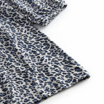 Leopard blue dress for children with elastic in the sleeves and a button-up back.