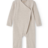 Beige sweatshirt for baby with diagonal button closure.