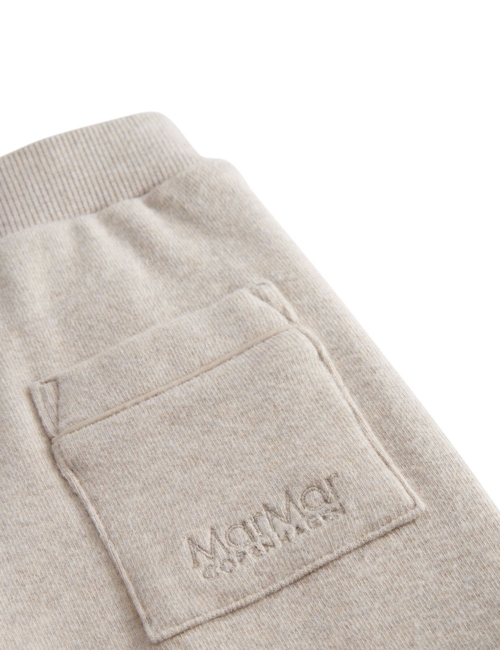 Beige baby sweatpants with elastic waist.