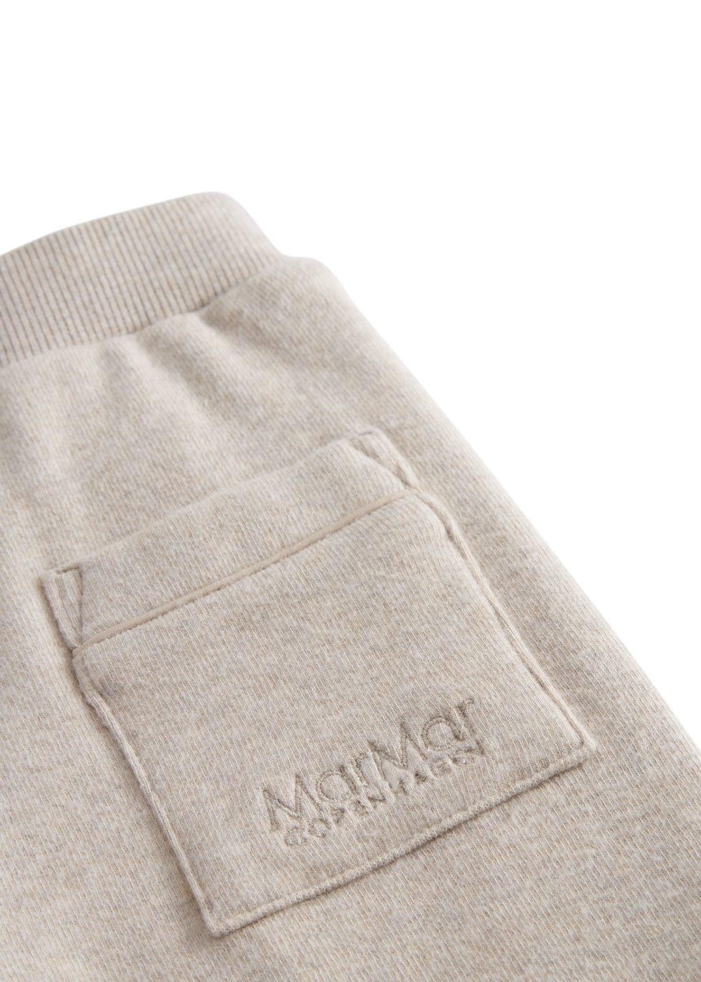 Beige baby sweatpants with elastic waist.