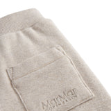 Beige baby sweatpants with elastic waist.