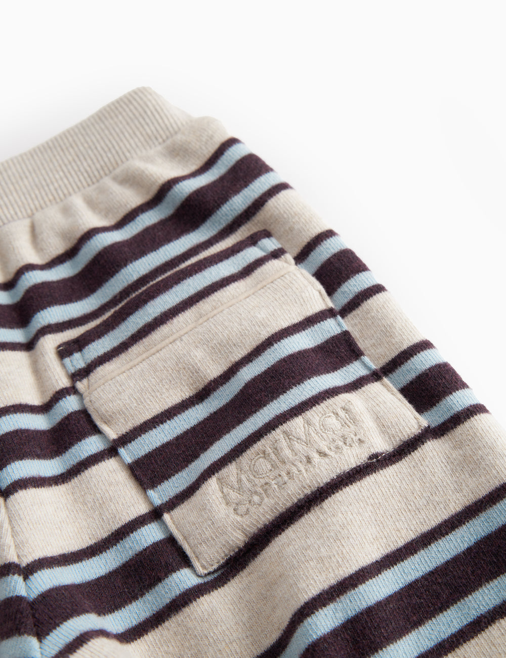 Striped baby sweatpants with elastic in the waist and pocket.
