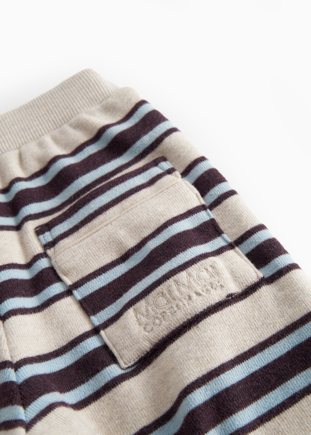 Striped baby sweatpants with elastic in the waist and pocket.