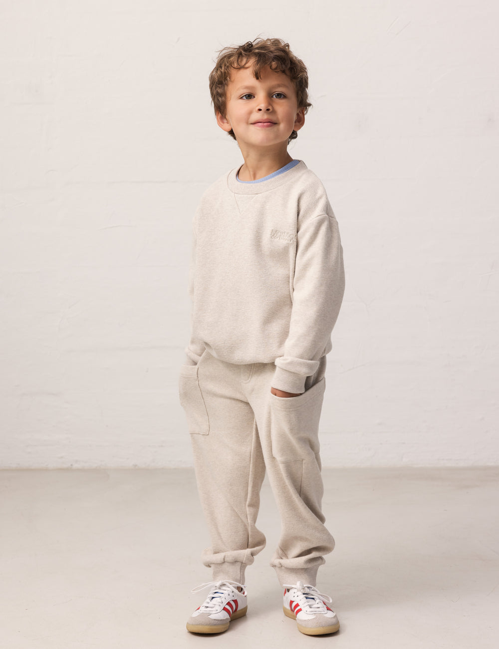 Children wearing sweatpants with pockets and ribbed waistband, matching matching matching.
