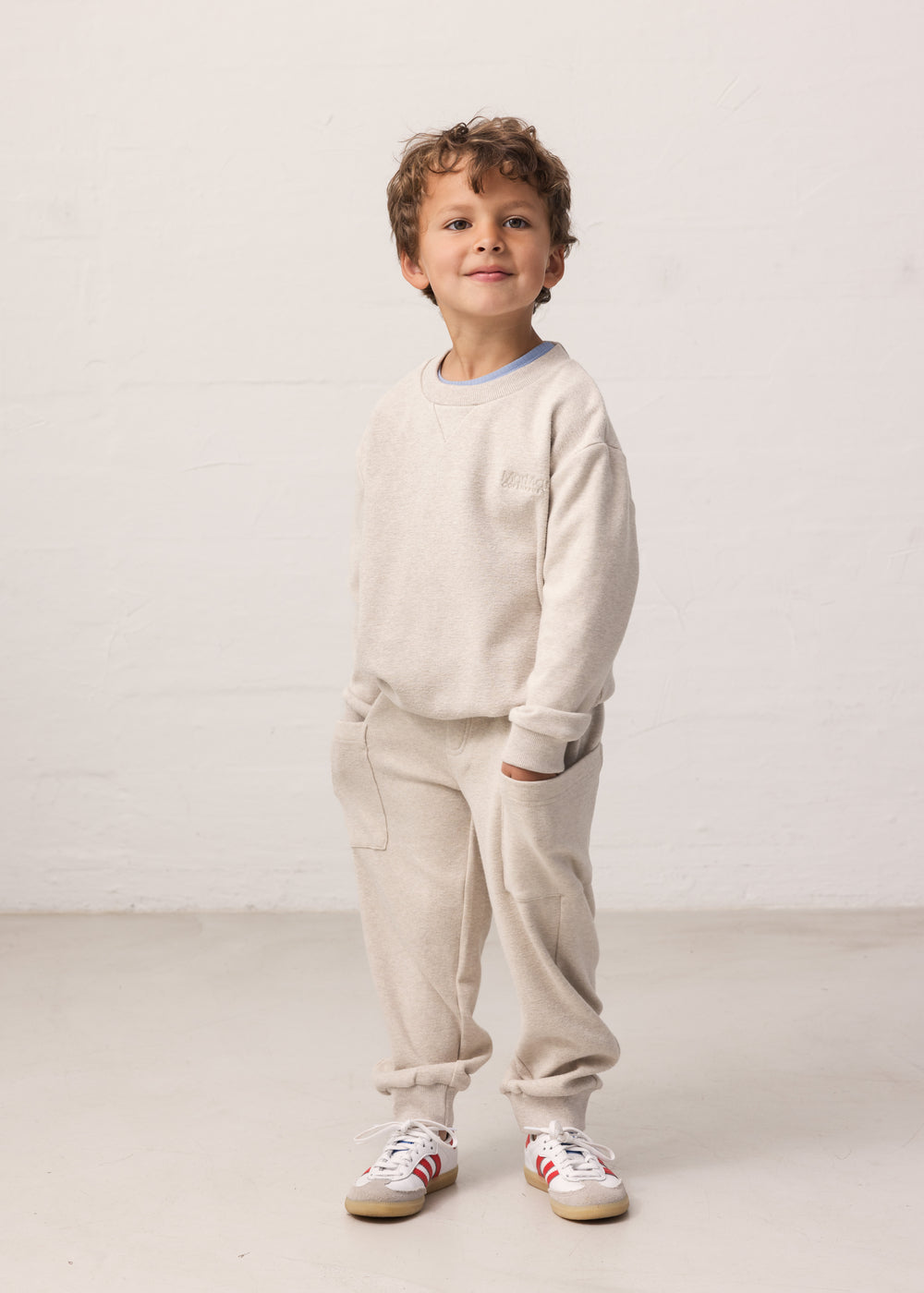 Children wearing sweatpants with pockets and ribbed waistband, matching matching matching.