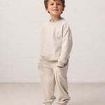 Children wearing sweatpants with pockets and ribbed waistband, matching matching matching.