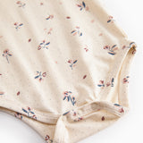 Langärmet baby bodystocking with floral print and snap closure