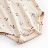 Langärmet baby bodystocking with floral print and collar