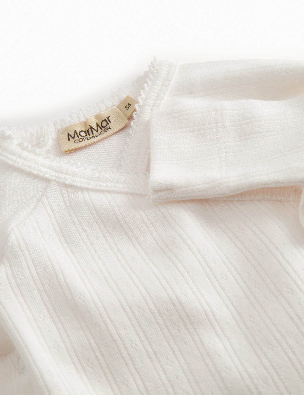 White pointelle bodystocking for newborns